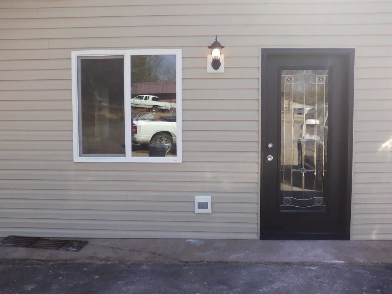 New siding, window and entry door on the side of an addition in Jefferson